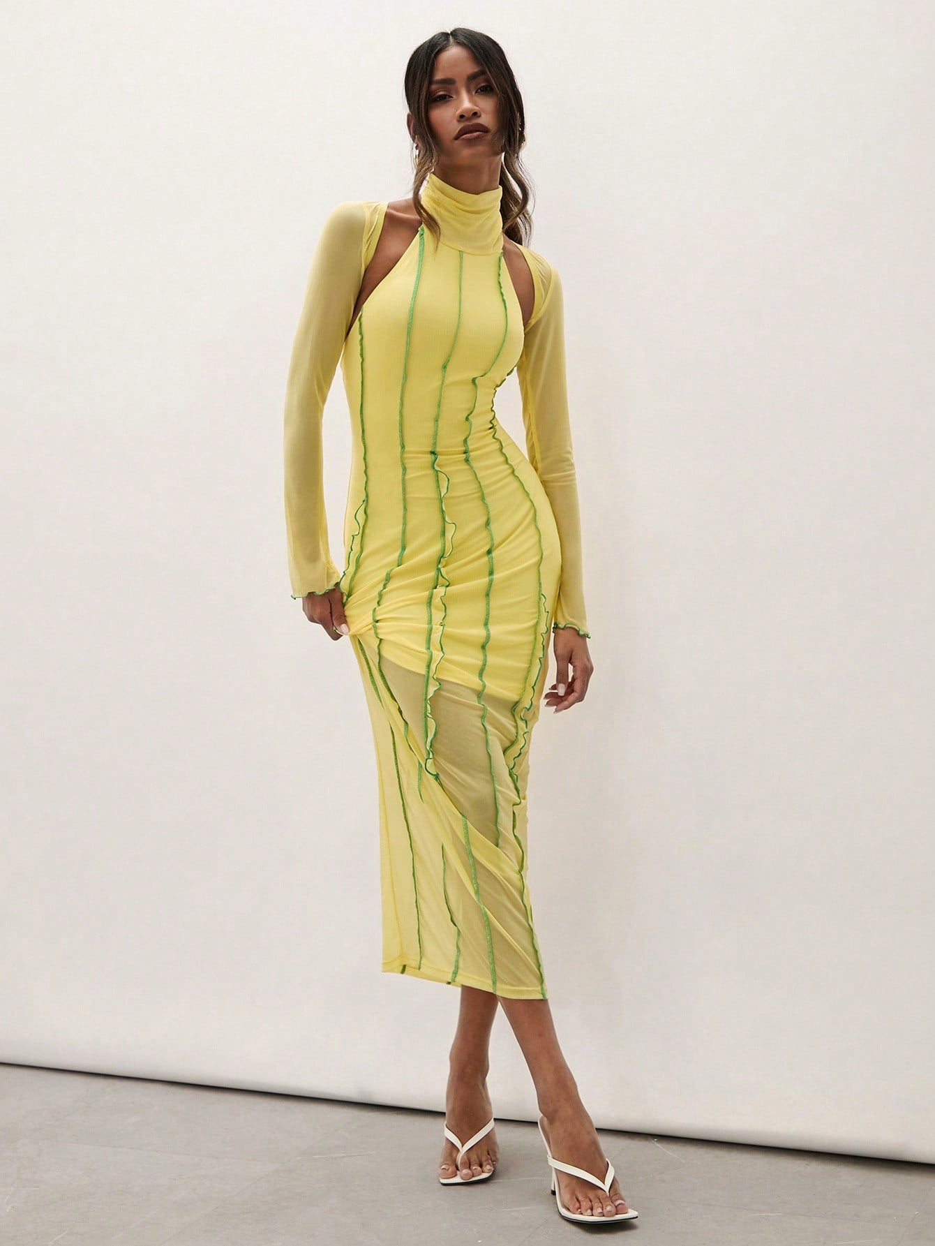 Turn heads effortlessly in this chic high neck dress featuring long sleeves and a daring backless cut. The fitted silhouette hugs your curves, while the stylish contrast mesh adds a flirty, modern twist. Perfect for evenings when you want to mix elegance with a touch of playful edge.