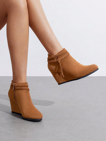 Step up your style game with these chic high wedge ankle boots designed for the bold and playful woman. Featuring charming braided straps and playful tassels, they bring personality and flair to any outfit. The high wedge provides extra height without sacrificing comfort, making them perfect for all-day wear. These boots are the ideal blend of fun and function, crafted to keep you looking fabulous wherever you go.