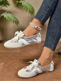 Step into timeless elegance with these charming lace-up ballet flats. Designed with a soft, flexible bottom that moves with your feet, they deliver all-day comfort without compromise. The retro-inspired lacing detail adds a touch of vintage sophistication, while the sleek silhouette pairs effortlessly with skirts, dresses, and casual everyday outfits. Whether you're heading to the office or out for a leisurely weekend, these flats are your go-to choice for understated style that never goes out of fashion.