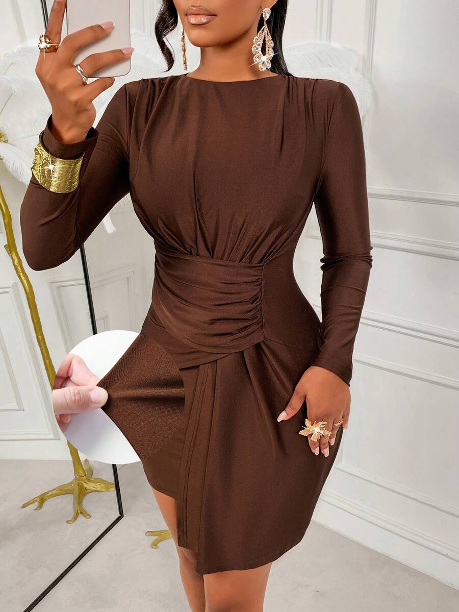 Elevate your seasonal wardrobe with this stunning asymmetrical mini dress that's equal parts bold and sophisticated. The long sleeves provide cozy coverage while the playful off-kilter hemline keeps things fresh and fashion-forward. Perfect for autumn cocktails, winter parties, or anywhere you want to turn heads, this piece proves that chic doesn't have to mean predictable. Slip it on with your favorite heels and watch the compliments roll in.