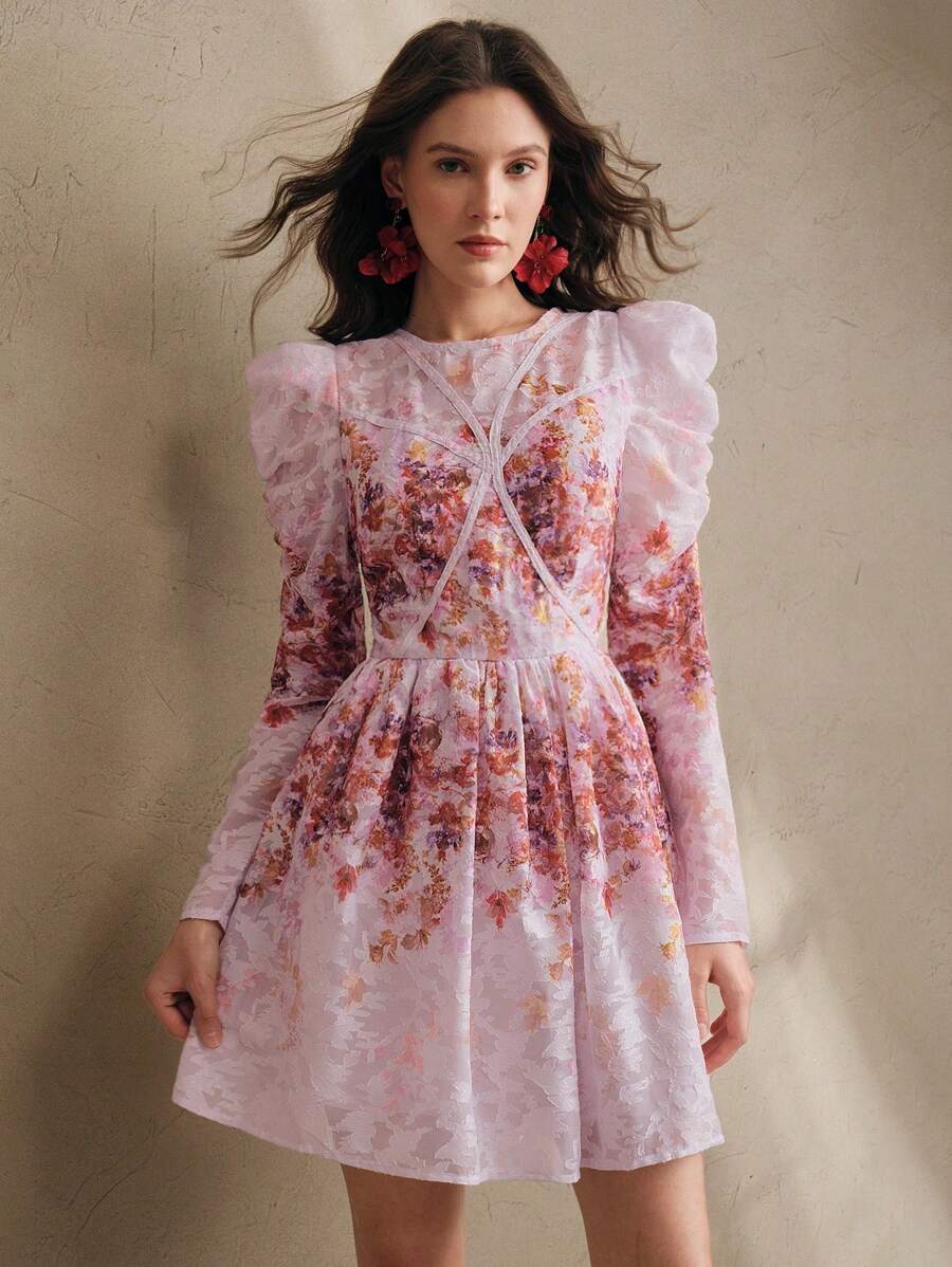 Step into spring and summer celebrations with this playful pink floral mini dress. The delicate mesh overlay adds a touch of elegance while keeping the look light and breezy. Perfect for garden parties or sunny afternoons, this dress combines charm and comfort for effortless style.