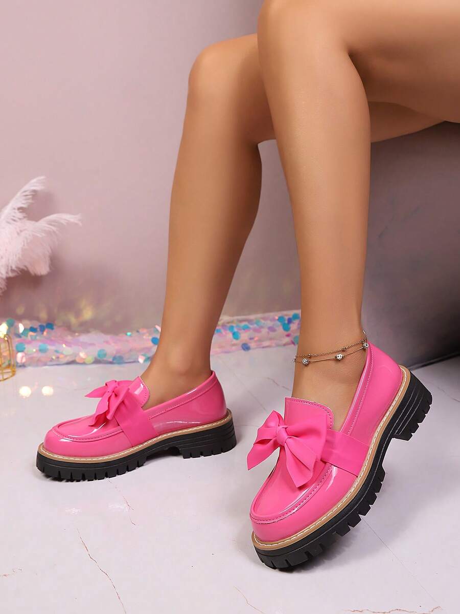 Make a statement with these charming pink patent leather loafers, designed with a delicate bow accent and supportive platform heel. Constructed from quality PU leather with a resilient rubber outsole, these effortless slip-ons blend timeless preppy aesthetics with contemporary flair. Ideal for school days, festive celebrations, or weekend adventures, they offer the perfect balance of style and practicality. The cushioned thick sole ensures all-day comfort while the lustrous finish brings a playful pop of co