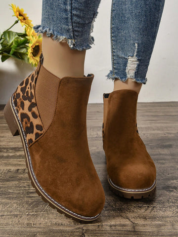 Elevate your style with our chic round toe Chelsea ankle boots. Crafted with comfort in mind, our boots feature a chunky low heel that provides stability and support. Perfect for any occasion, these boots will add a touch of sophistication to your wardrobe while keeping your feet happy.