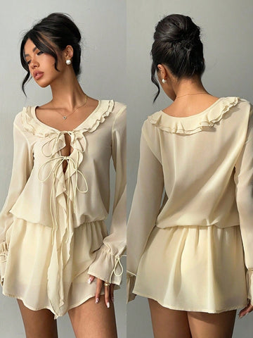 Flirt with confidence in this charming mini dress that's equal parts romantic and fun. The delicate ruffle front and tie detail create an effortlessly chic silhouette that turns heads at summer dates, honeymoons, and wedding celebrations. Lightweight and flattering, it's your go-to piece for making memorable moments even more stylish. Whether you're saying "I do" or just saying yes to adventure, this dress delivers the perfect blend of elegance and playfulness.