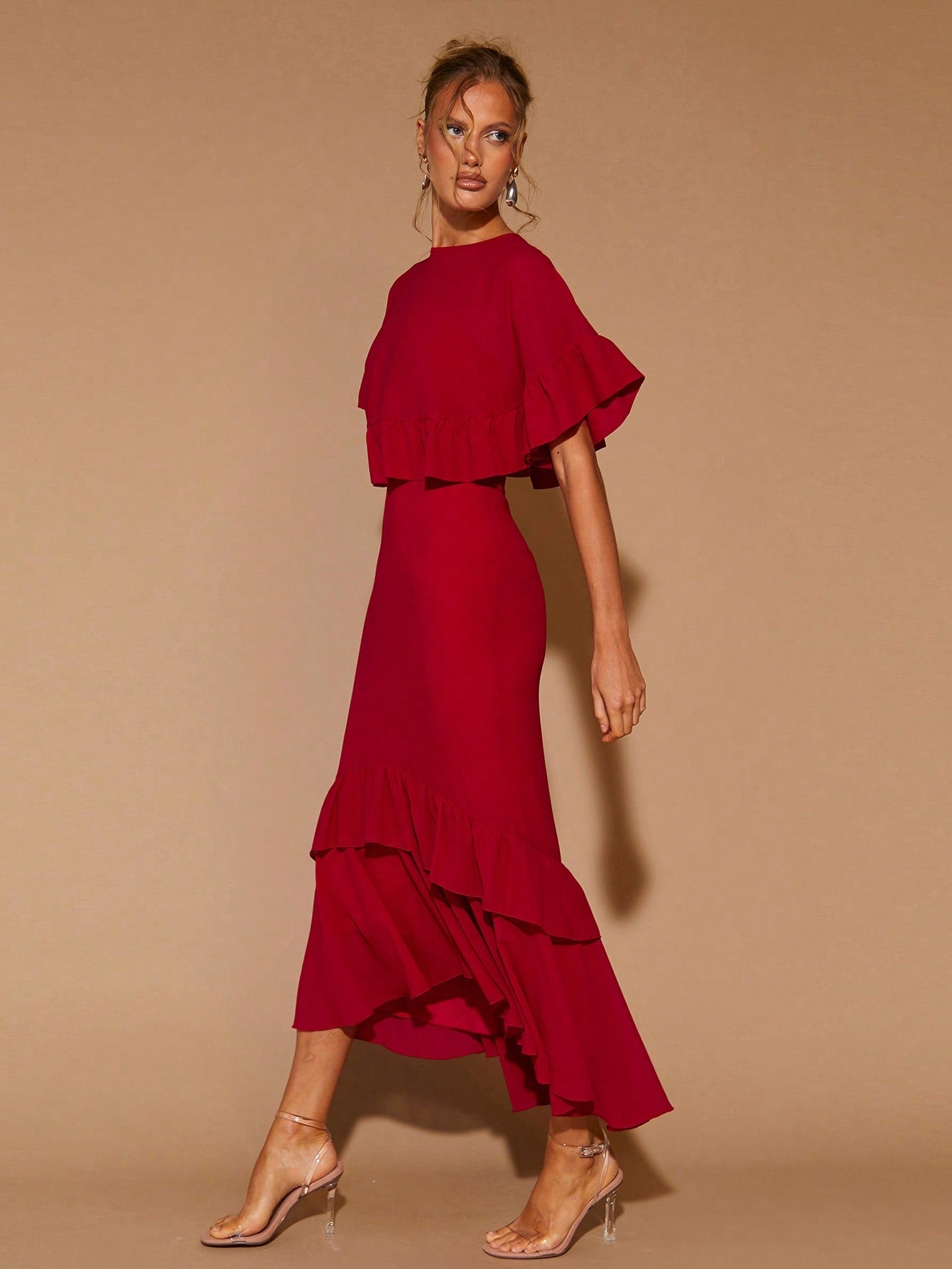 Elevate your party game with this stunning red midi dress that's equal parts sophisticated and fun. The delicate ruffle trim adds a flirty touch, while the classic round neckline keeps things timeless and flattering. Perfect for date nights, celebrations, or whenever you want to feel absolutely fabulous. This versatile piece transitions beautifully through seasons, making it a wardrobe essential that works year-round. Slip it on and watch heads turn.