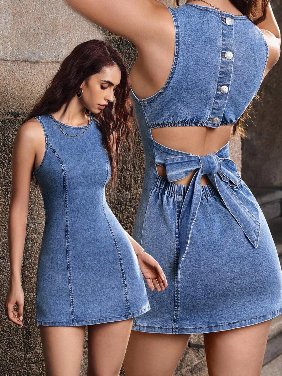 Rock a timeless denim look with an effortless twist! This sleeveless cropped mini dress combines classic denim appeal with modern edge. The adjustable tie waist lets you customize your fit while creating a flattering silhouette, perfect for showing off your style. Whether you're dressing it up for a night out or keeping it casual, this versatile piece transitions seamlessly from day to night. Pair it with sneakers for laid-back vibes or heels for something more polished—the possibilities are endless!
