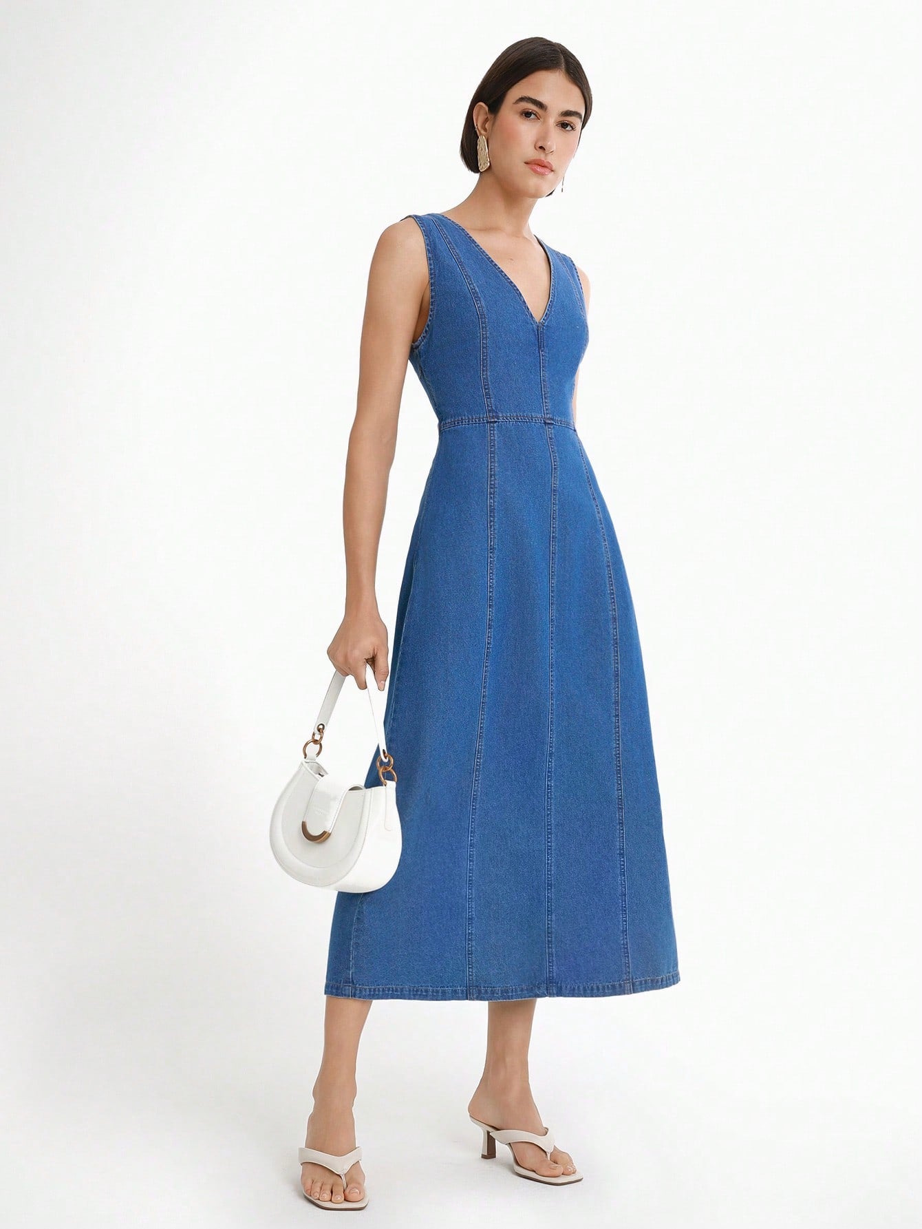Step out in style with this chic sleeveless denim dress featuring a flattering V-neck. Its casual yet trendy design makes it your go-to for sunny days, weekend hangouts, or spontaneous adventures. Lightweight and easy to wear, this dress adds a playful touch to your wardrobe while keeping comfort front and center. Perfect for mixing and matching with your favorite accessories!