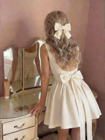 Effortless elegance meets summer style in this chic sleeveless dress. Crafted from luxurious satin, this beige beauty features a flattering regular fit with delicate straps and a stunning backless design accented by a bow detail. The shirred bodice and hidden zipper closure add refined touches, while the short length keeps things fresh and flirty. Perfect for dating, festivals, or casual outings, this versatile piece transitions seamlessly from day to night. 