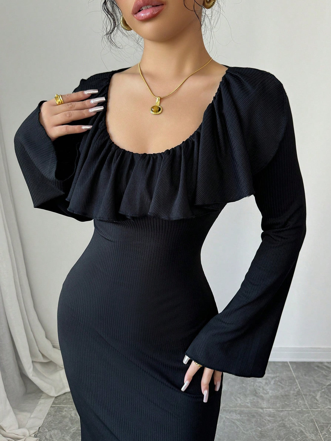 Get ready to turn heads with this chic midi dress that features a ruffled v-neckline and a stylish waist slit. Perfect for any evening occasion, this dress will add a touch of elegance to your wardrobe. Stand out from the crowd and make a statement with this fashionable and playful dress.