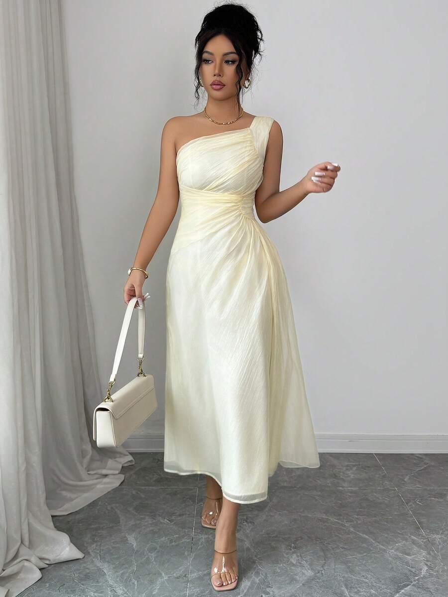 Elevate your everyday style with this sophisticated sleeveless midi dress. Crafted in a timeless solid color, it features delicate pleated details and charming ruffle accents that add movement and dimension. The midi length offers versatile wear—dress it up for brunch or pair it with sneakers for casual outings. Perfect for warm weather, this piece transitions seamlessly from day to night, making it an essential addition to any wardrobe.