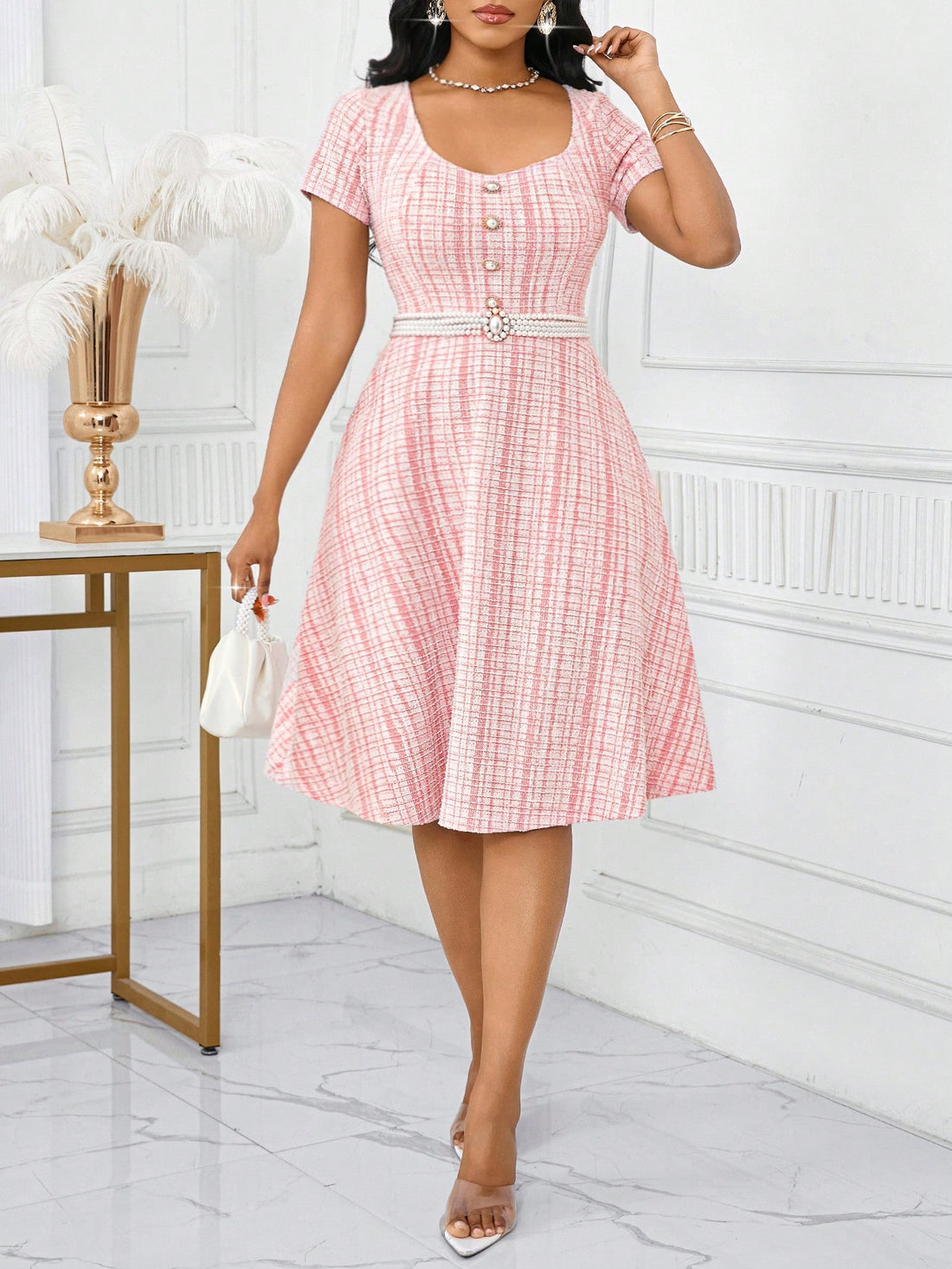 Swing into summer with our playful plaid midi dress! This chic number transitions effortlessly from brunch dates to evening soirées with its flattering silhouette and eye-catching pattern. The breezy fabric keeps you cool while turning heads—because who says plaid can't be flirty? Perfect for the fashion-forward woman who loves to mix fun with elegance!