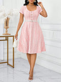 Swing into summer with our playful plaid midi dress! This chic number transitions effortlessly from brunch dates to evening soirées with its flattering silhouette and eye-catching pattern. The breezy fabric keeps you cool while turning heads—because who says plaid can't be flirty? Perfect for the fashion-forward woman who loves to mix fun with elegance!