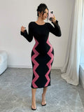 Front view of pink and black colorblock knit midi dress with boat neck and gently flared long sleeves