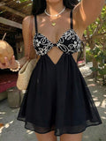 Make a stylish statement on your next getaway with this Chic Women's Textured Cut-Out Mini Dress, designed for effortless vacation elegance. Featuring a unique textured fabric and modern cut-out details, this mini dress combines feminine charm with a trendy silhouette that's perfect for warm-weather occasions.