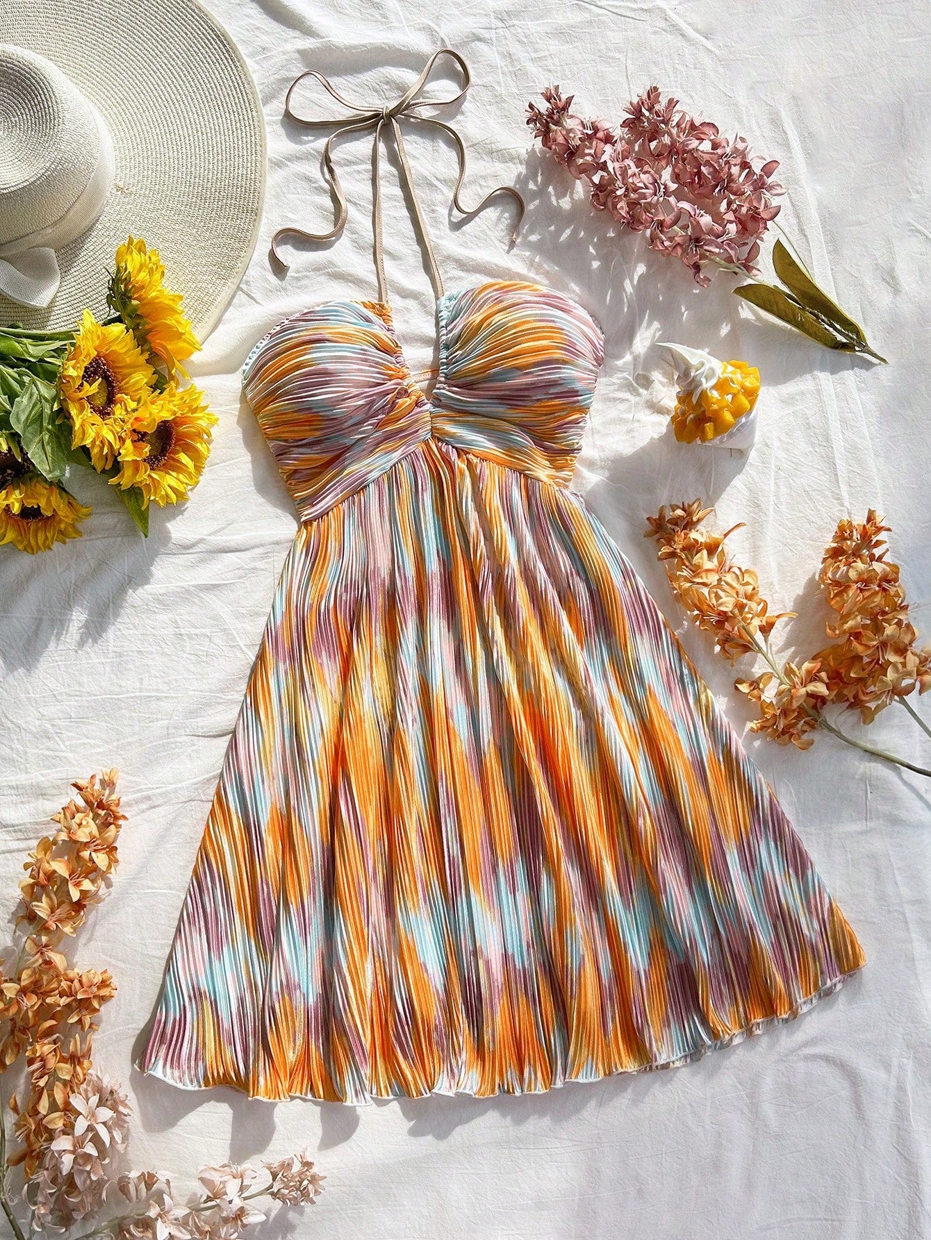 Step out in style with this playful tie-dye floral mini dress, designed to brighten your wedding season and add charm to any date night. Its vibrant pattern and flirty cut make it a fun, effortless choice for memorable moments. Lightweight and breezy, it keeps you comfortable while turning heads wherever you go.