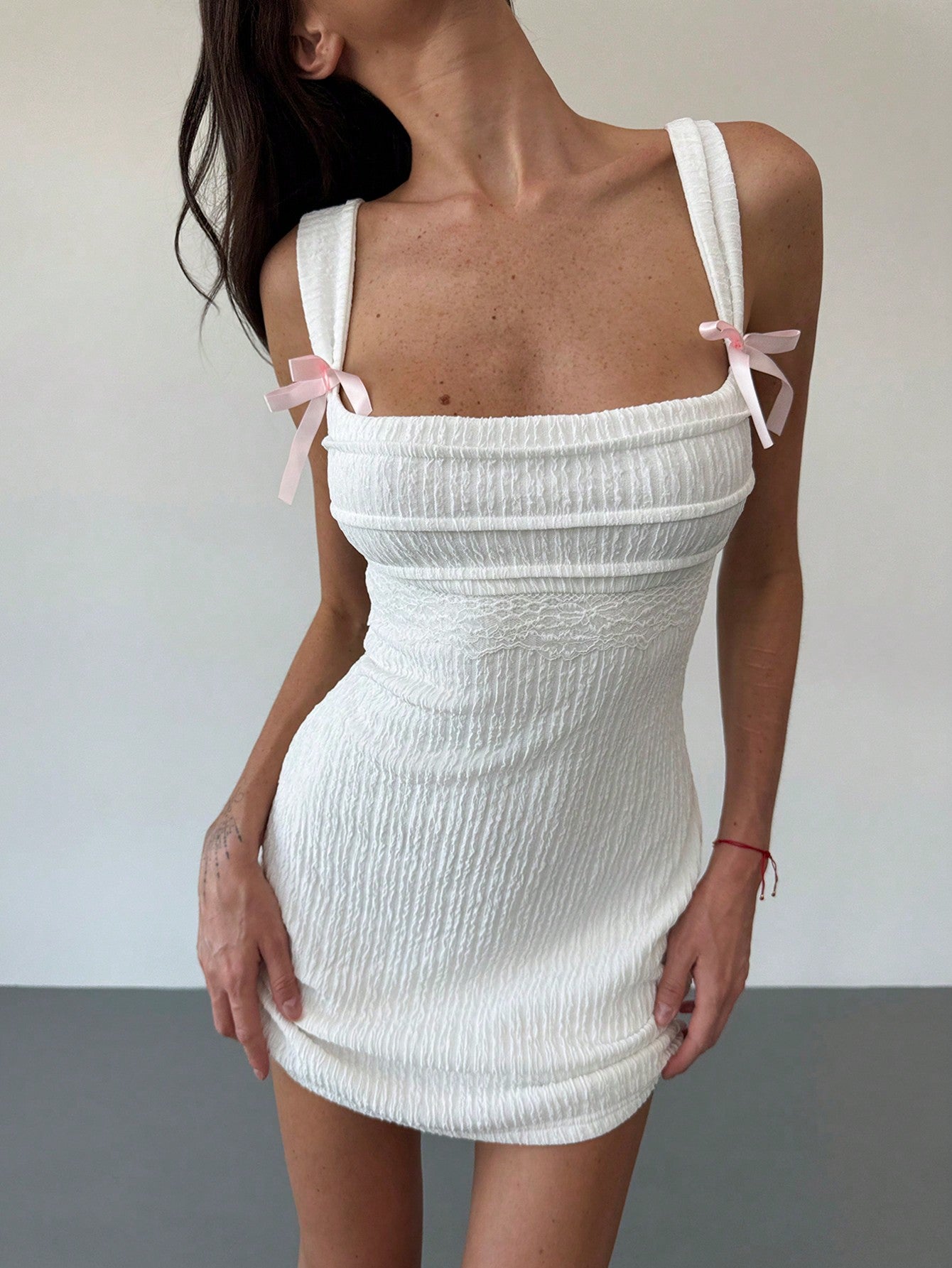 Get ready to turn heads in this chic Y2K-inspired bodycon mini dress! With its bold bow detail and backless design, this dress is perfect for making a statement at any event. Embrace your unique style and stand out from the crowd with this must-have dress. (Fabulousness guaranteed!)