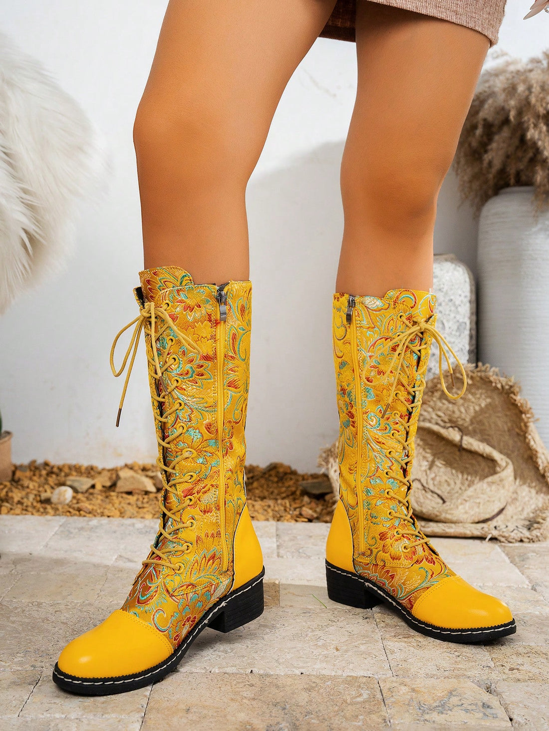 Elevate your style with our Chic Yellow Floral Embroidery Knee-High Boots! Perfect for all seasons, the vibrant floral embroidery adds a stylish touch while the knee-high design offers ultimate comfort and support. Make a statement with these must-have boots!