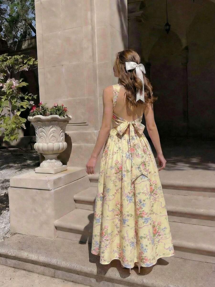 Pale yellow floral open-back A-line maxi dress with bow tie waist
