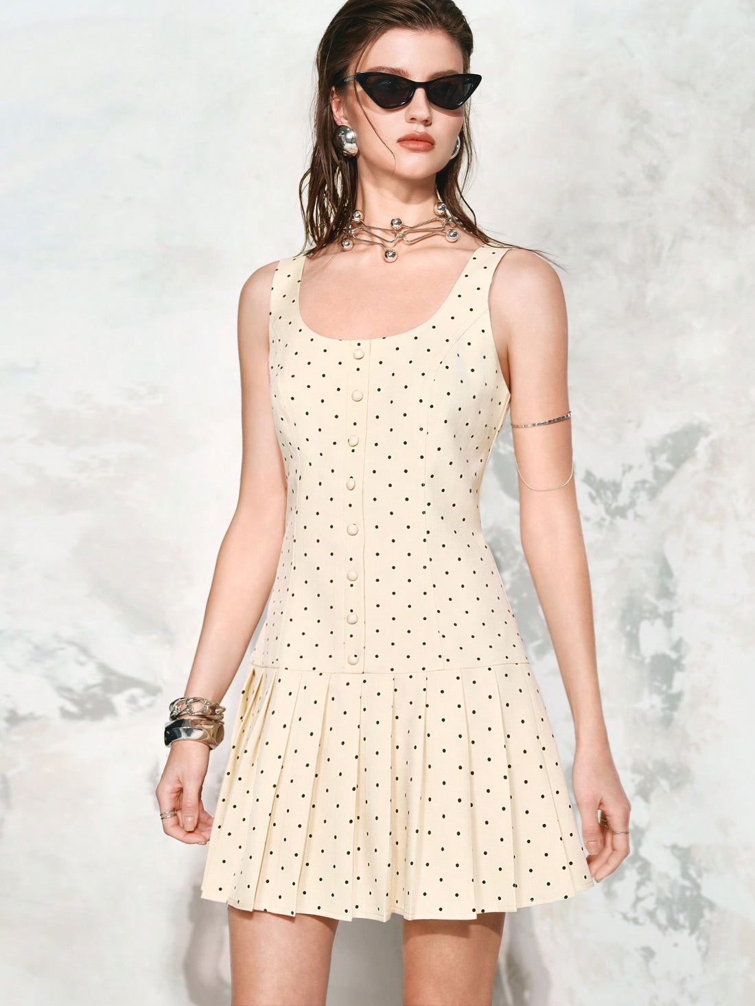 Brighten your summer days with this playful yellow polka dot mini dress. Featuring a flattering scoop neck and breezy sleeveless design, its pleated skirt adds a fun, flirty touch perfect for sunny outings or casual gatherings. Lightweight and stylish, it’s your go-to outfit for effortless charm and comfort all season long.