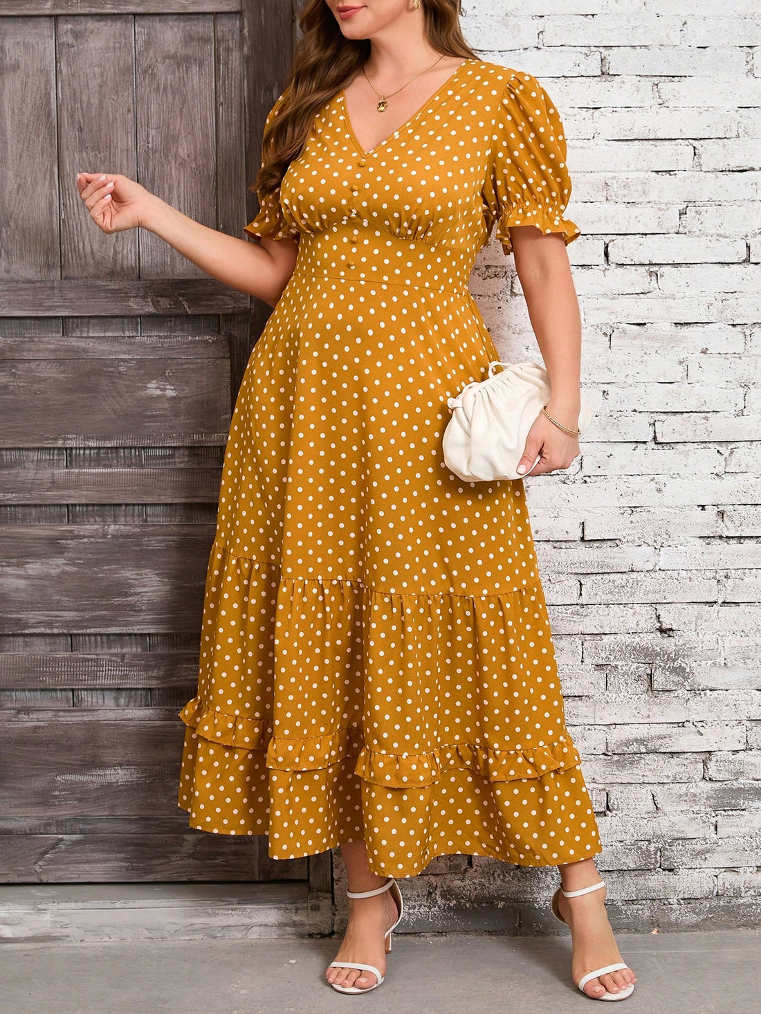 Get ready to turn heads in this chic yellow polka dot plus size maxi dress! The ruffle hem adds a touch of romance, making it perfect for vacations or elegant outings. With its flattering fit and playful print, this dress is sure to make you stand out in the best way possible.