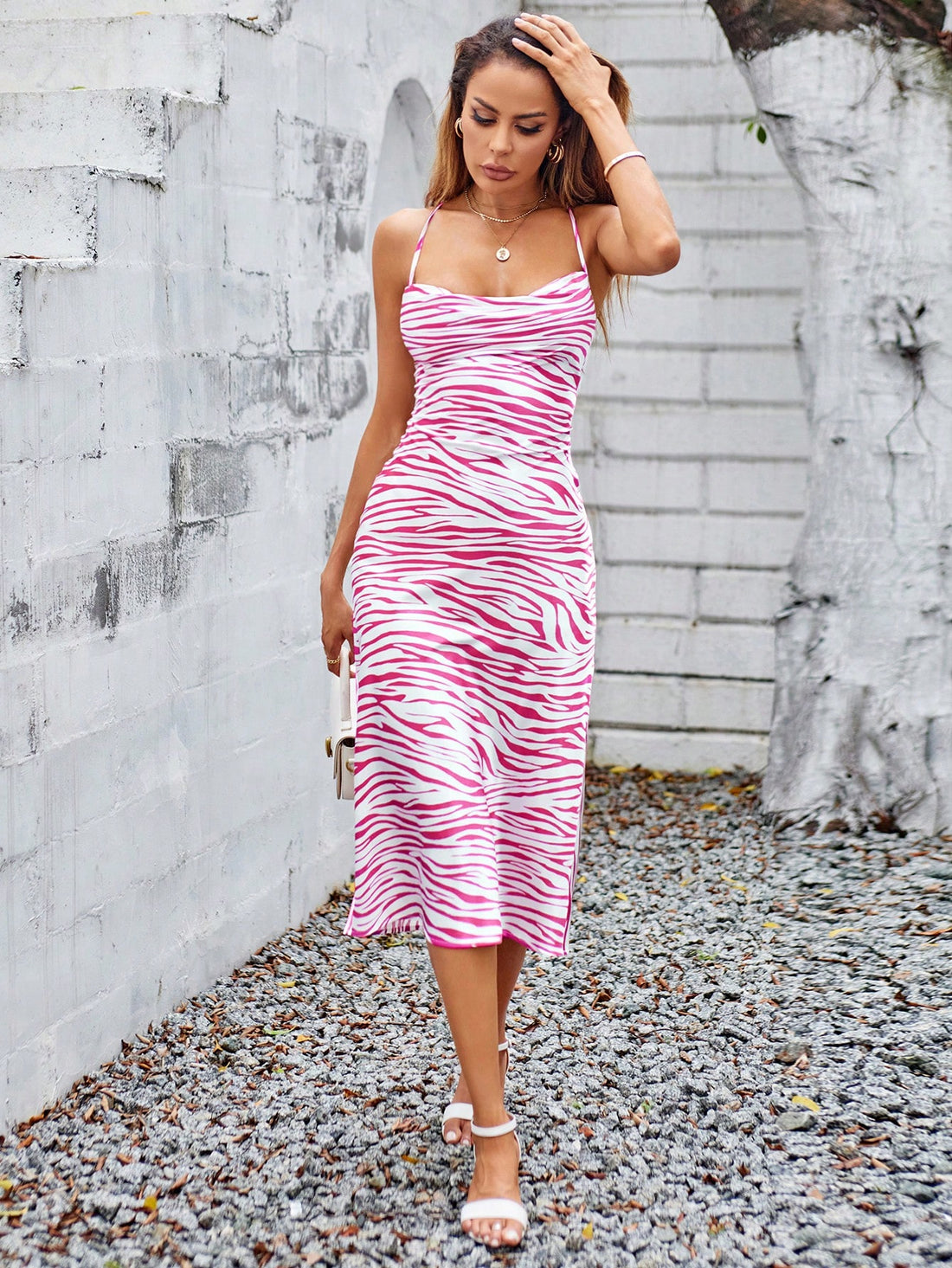 Get ready to strut your stuff in this Chic Zebra Print Backless Cami Dress! Not only is it perfect for summer vibes, but the backless design adds a touch of flirtiness. Don't miss out on this trendy piece that will make you stand out from the crowd!