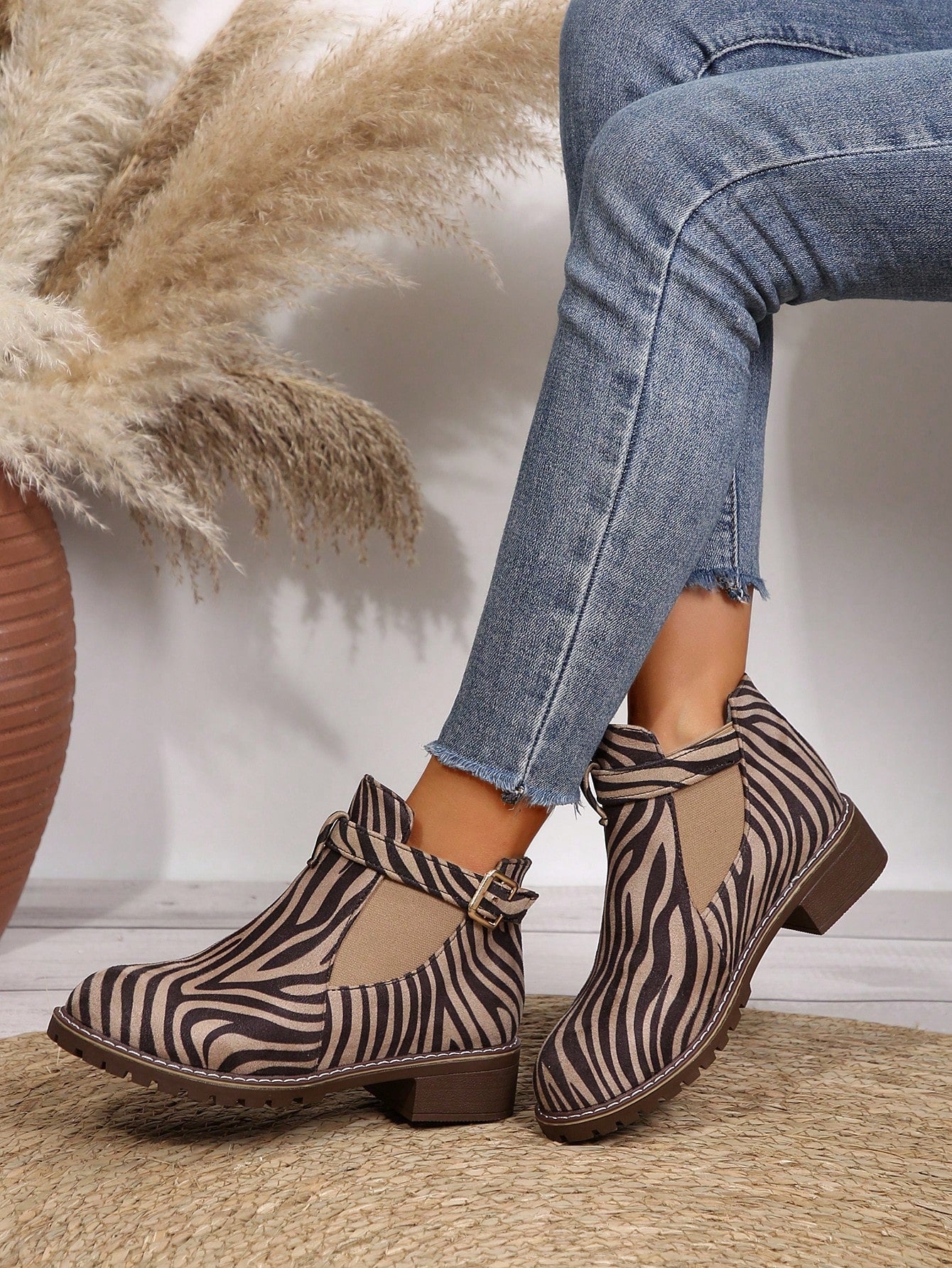 Introducing our Chic Zebra Print Chunky Low Heel Boots - the perfect versatile fashion choice for the autumn and winter seasons. These boots are not only stylish with their trendy zebra print design, but also comfortable with a low heel and perfect for any occasion. Upgrade your shoe collection with these must-have boots.