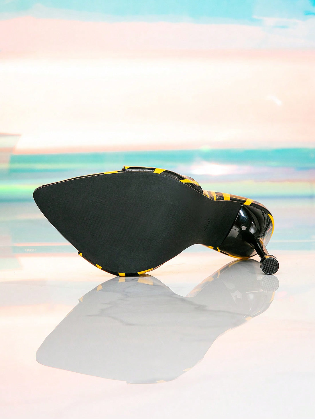 Take a walk on the wild side with our Chic Zebra Striped Peep-Toe Stilettos! These bold yellow and black mules are perfect for a night out at the club, adding a touch of sophistication and fun to your outfit. With their unique design and stylish look, you'll be the talk of the town!