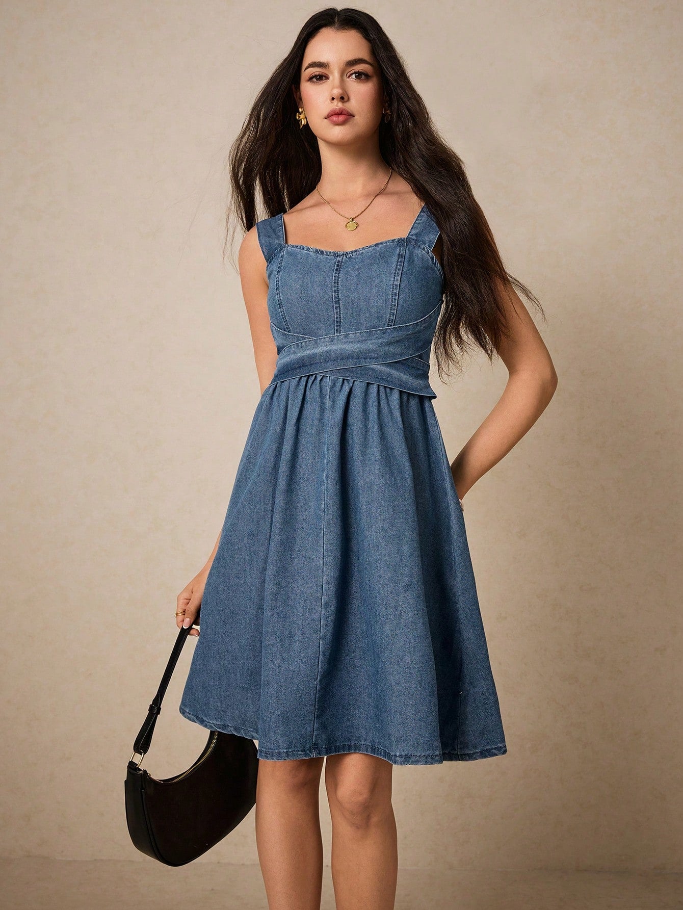 Effortlessly style yourself in this chic and casual denim suspender midi dress. Its A-line shape and midi length will flatter any figure, while the suspenders add a touch of playfulness. Perfect for a day out, this dress exudes effortless style.