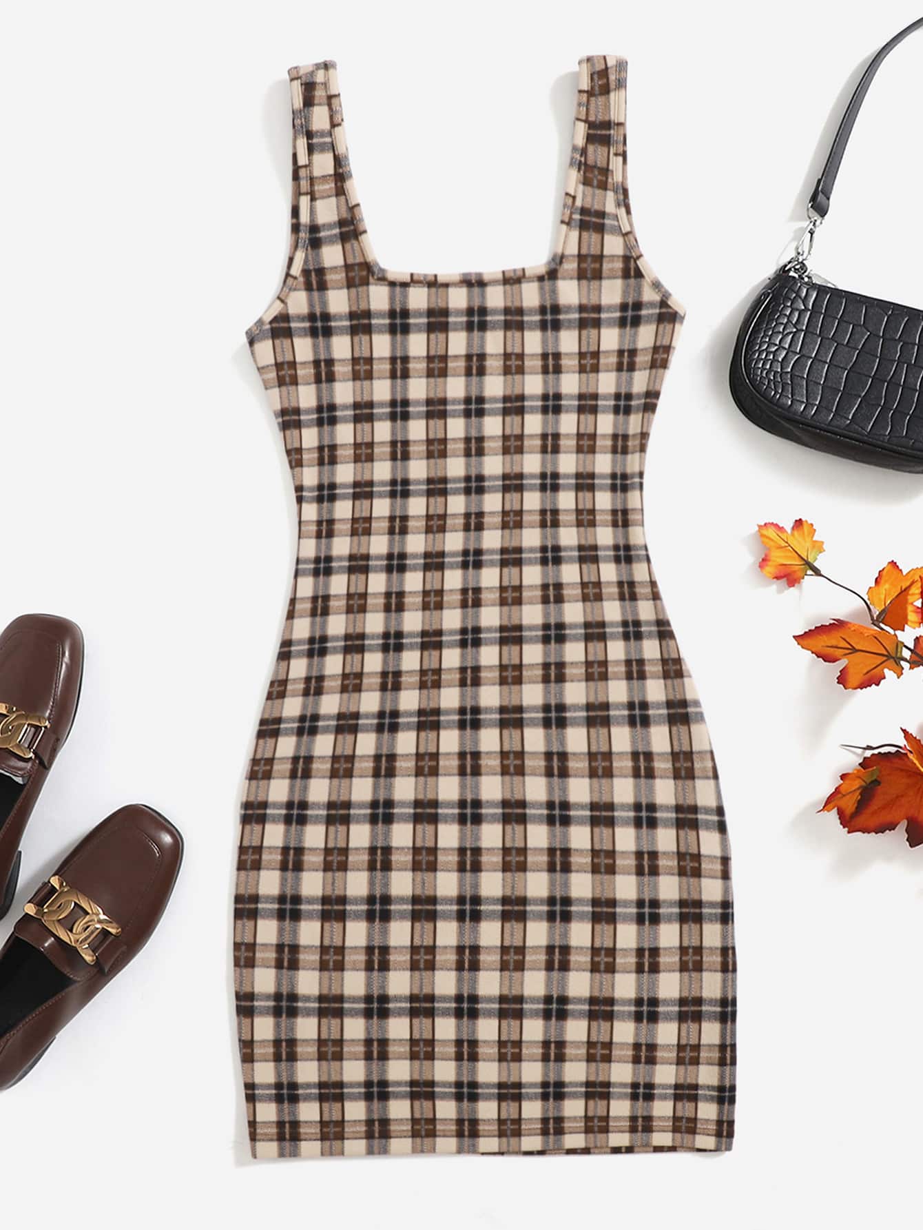 This chic and comfortable dress features a stylish plaid print that will elevate your wardrobe. Made with soft and breathable fabric, it offers both fashion and comfort for any occasion. Stay on trend and comfortable with this versatile cami dress.