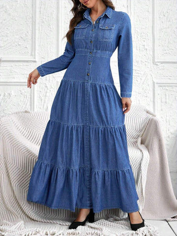 Front view of medium wash denim maxi shirt dress with collar buttons and chest pockets