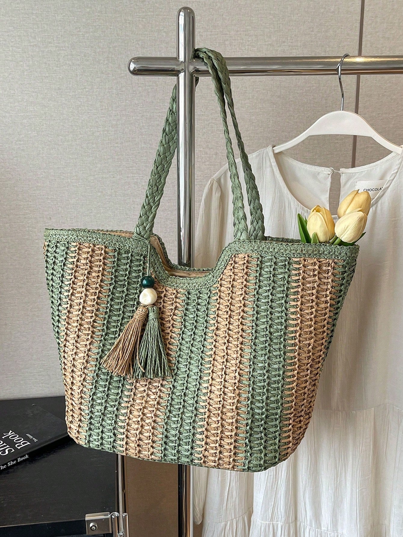 Expertly crafted from woven straw, the Chic and Roomy tote bag is perfect for the minimalist woman. With its spacious design, it effortlessly blends style and functionality. Whether for a day at the beach or a weekend getaway, this bag is sure to elevate any outfit.