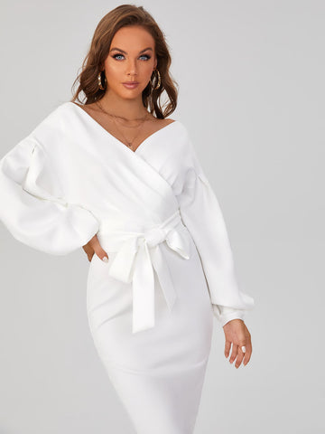 Elevate your style with our Chic and Sophisticated dress. Featuring a surplice neckline and drop shoulder design, this dress exudes both elegance and confidence. The belted waist accentuates your figure, making you feel chic and sophisticated. Elevate your wardrobe and stand out from the crowd with this must-have dress.