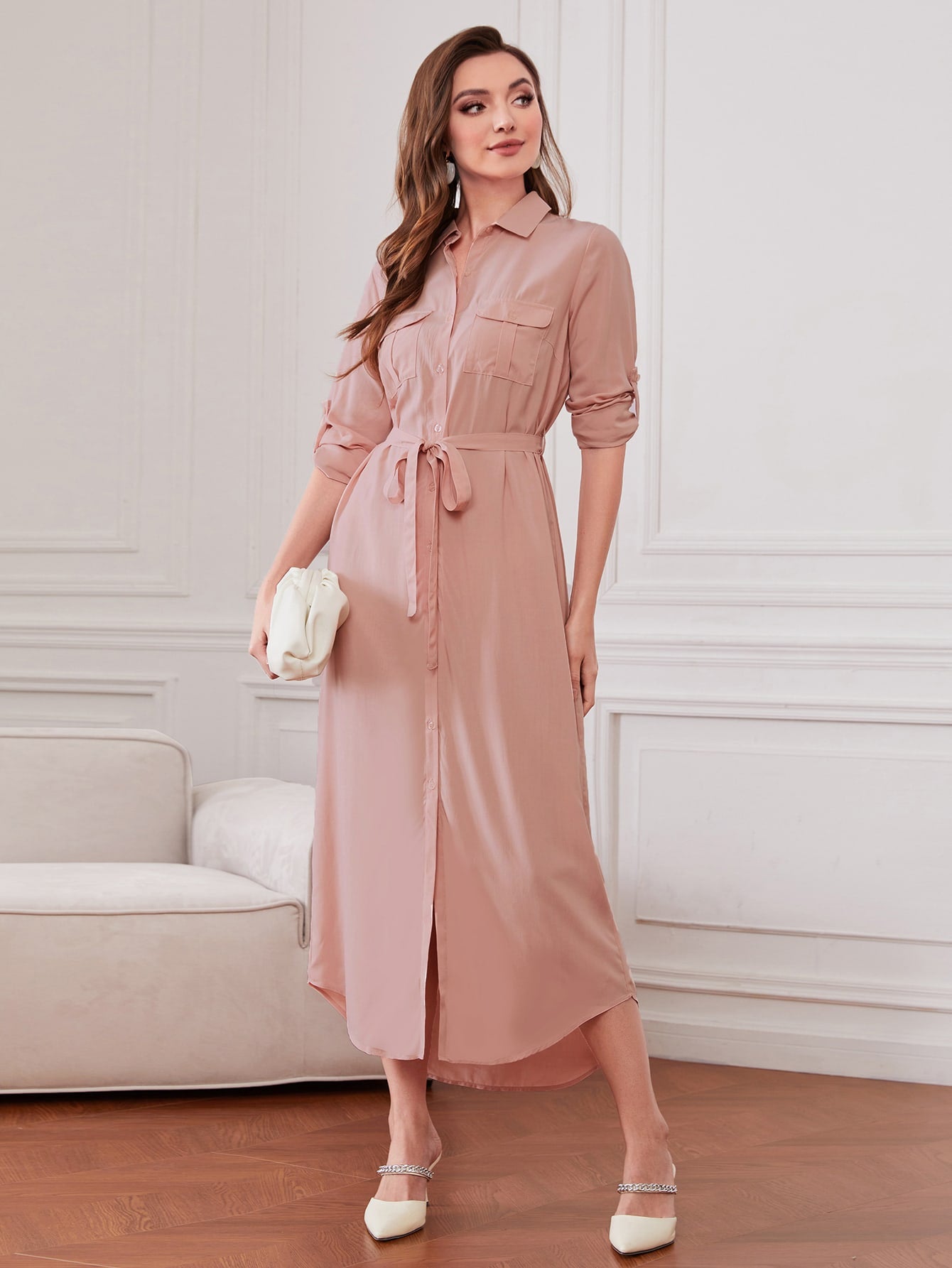 Elevate your wardrobe with our Chic and Versatile Belted Shirt Dress. Roll-up sleeves give a relaxed look while the belted waist accentuates your figure. Perfect for any occasion, this dress is both stylish and comfortable. Get ready to turn heads and make a statement with this must-have piece.