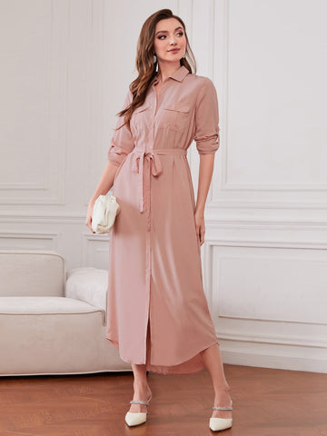 Elevate your wardrobe with our Chic and Versatile Belted Shirt Dress. Roll-up sleeves give a relaxed look while the belted waist accentuates your figure. Perfect for any occasion, this dress is both stylish and comfortable. Get ready to turn heads and make a statement with this must-have piece.