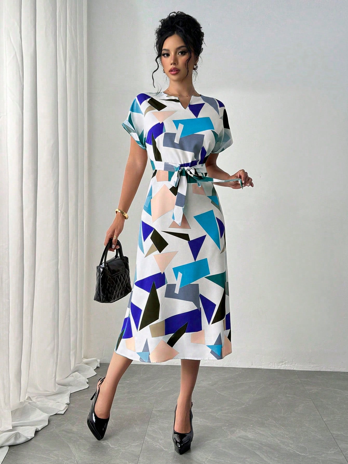 Effortlessly chic and versatile, this color block midi dress is a must-have for your spring and summer wardrobe! With its bold and playful design, it's perfect for any occasion and will keep you looking stylish. Don't miss out on this must-have dress!