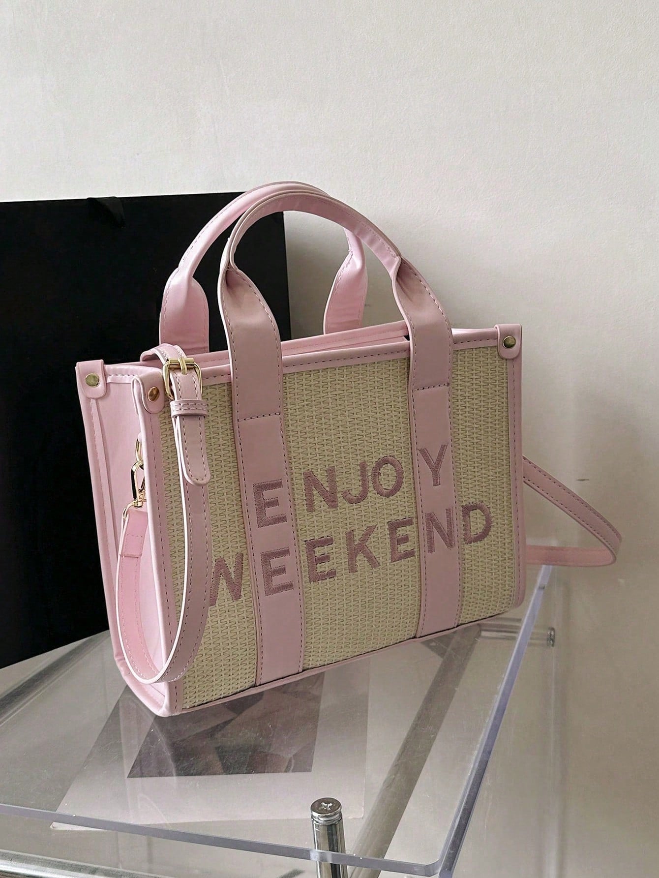 Elevate your style game with our versatile and chic minimalist letter woven tote bag. Crafted with expert craftsmanship and woven using quality materials, this bag is perfect for any occasion. With its stylish design and spacious interior, it's the perfect accessory for any fashion-forward individual.
