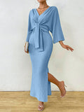 Step out in playful style with the Clasi Women's Minimalist Solid Color Front Tie Long Sleeve Maxi Dress. This quirky dress features a front tie and a slit for added fun and fashion. Its minimalist design is perfect for any occasion, making you stand out in the most playful way possible. (No pun intended!)
