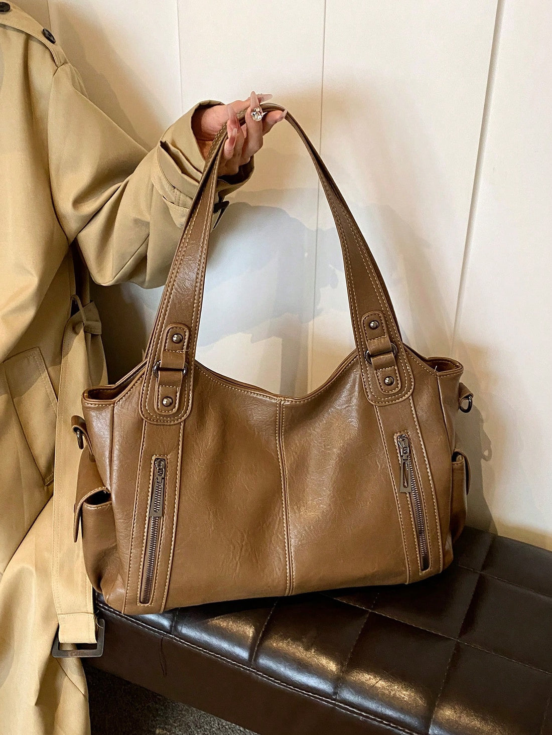 Our Classic Retro One-Shoulder Tote Bag offers a timeless and stylish design with a large capacity to effortlessly carry your belongings. Made with durable PU fabric, it's perfect for your shopping needs. Expertly crafted with a one-shoulder strap for easy and comfortable carrying. Upgrade your shopping experience with this must-have tote bag.