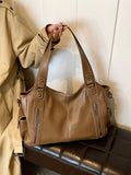 Our Classic Retro One-Shoulder Tote Bag offers a timeless and stylish design with a large capacity to effortlessly carry your belongings. Made with durable PU fabric, it's perfect for your shopping needs. Expertly crafted with a one-shoulder strap for easy and comfortable carrying. Upgrade your shopping experience with this must-have tote bag.
