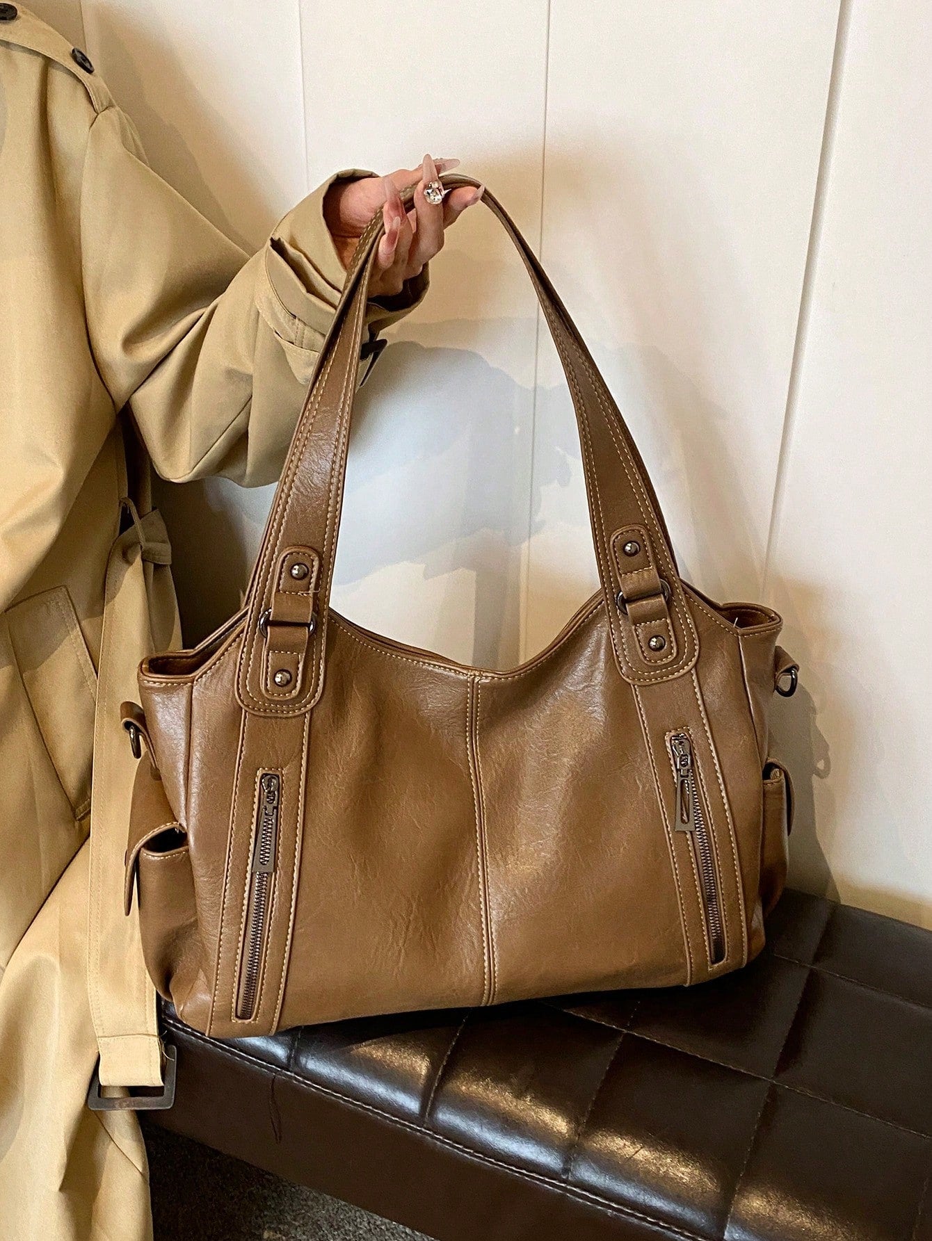Our Classic Retro One-Shoulder Tote Bag offers a timeless and stylish design with a large capacity to effortlessly carry your belongings. Made with durable PU fabric, it's perfect for your shopping needs. Expertly crafted with a one-shoulder strap for easy and comfortable carrying. Upgrade your shopping experience with this must-have tote bag.