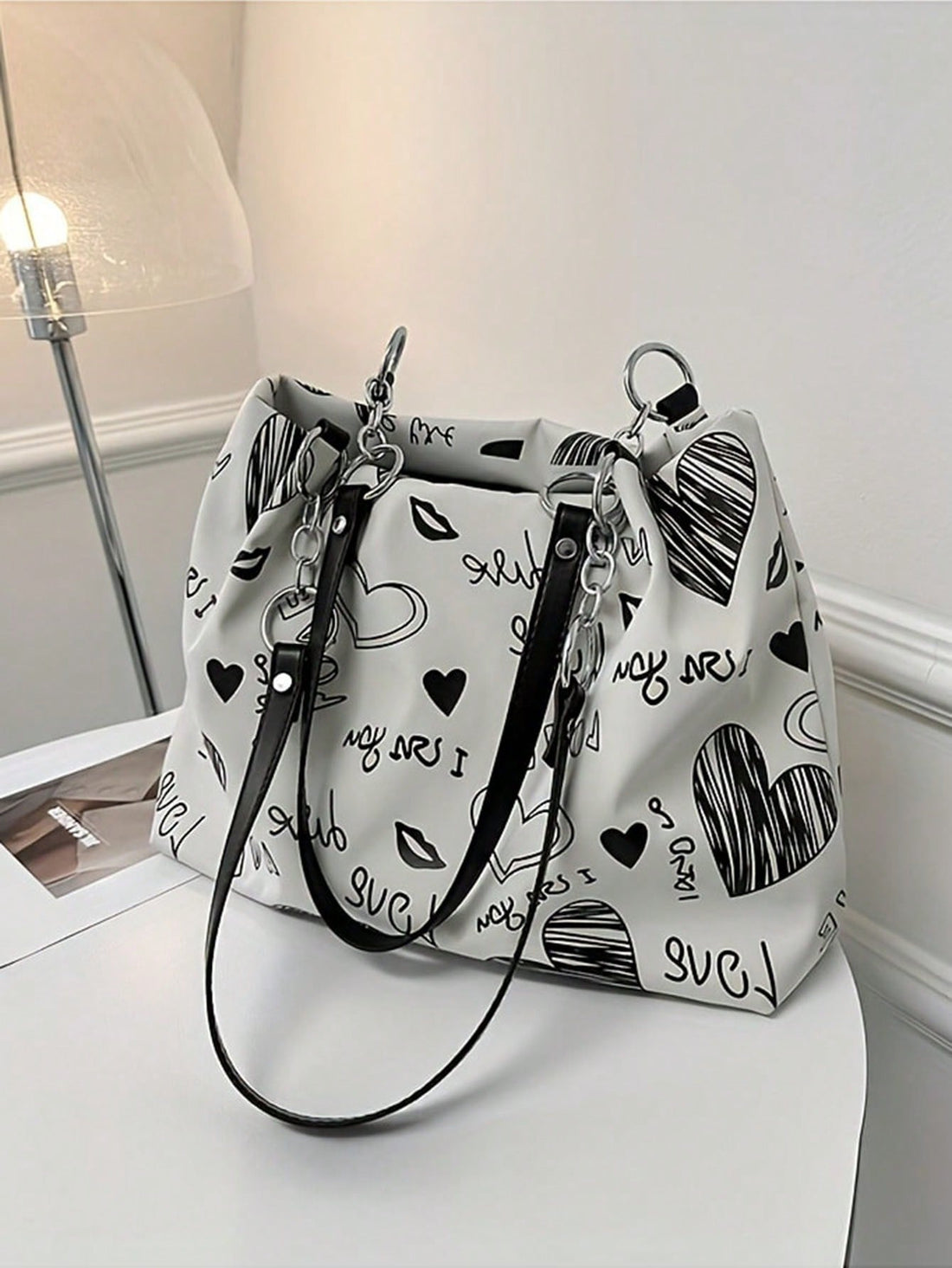 As an industry expert, I highly recommend our Classy Chain Decor Shoulder Bag. This elegant bag is perfect for teachers and travel enthusiasts, featuring a stylish chain decor and practical shoulder strap. With its functional design and classy look, it makes for the perfect gift. Don't miss out on this must-have accessory.