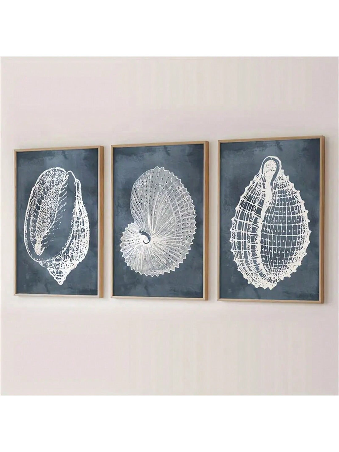 Enhance your home with a touch of seaside charm with our Coastal Charm 3-Piece Seashell Canvas Wall Art Set. This set features three beautifully crafted canvas prints, each showcasing a different seashell design, perfect for adding a beach-inspired element to any room. Made with high-quality materials, these pieces are built to last and will bring a sense of tranquility to your space.