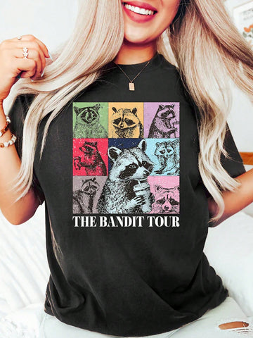 This Coffee-Loving Raccoon Graphic Tee features a fun and quirky design, perfect for any coffee-loving woman. Made from comfortable fabric, this t-shirt is a must-have for any casual outfit. Show off your love for coffee and your unique style with this graphic tee.