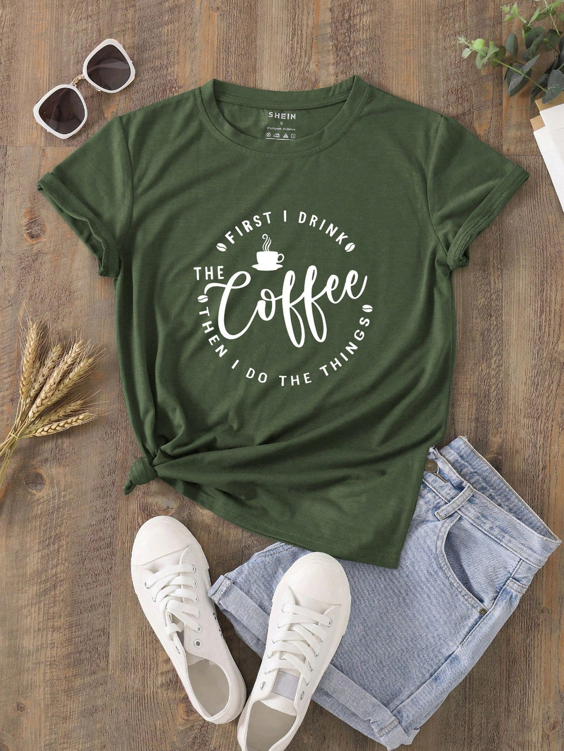 Get ready to tackle your day with a little extra motivation from this Coffee First Women's Graphic Tee. Perfect for everyday wear, this tee features a quirky saying that will make you smile. And what's better than starting your day with a cup of coffee? (Answer: Nothing.) So grab your caffeine fix and this tee for a winning combination.