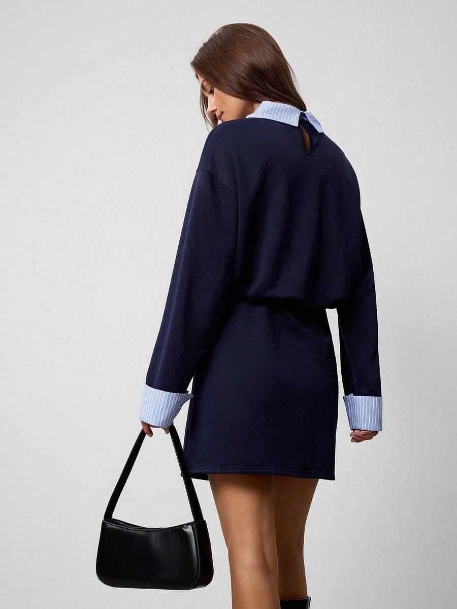 Rear three-quarter view of royal blue contrast collar mini dress with keyhole detail