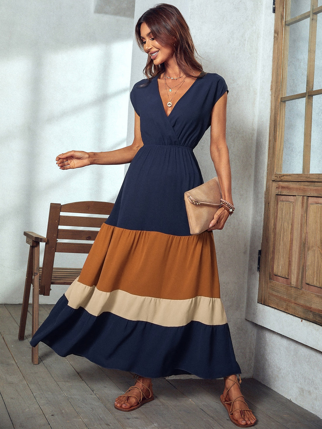Unleash your inner beach babe with our Colorblock Elegance Maxi Dress. Featuring a surplice neck design and vibrant colorblock pattern, this dress is perfect for vacation and beach getaways. Embrace elegance and comfort while making a statement (without taking yourself too seriously).