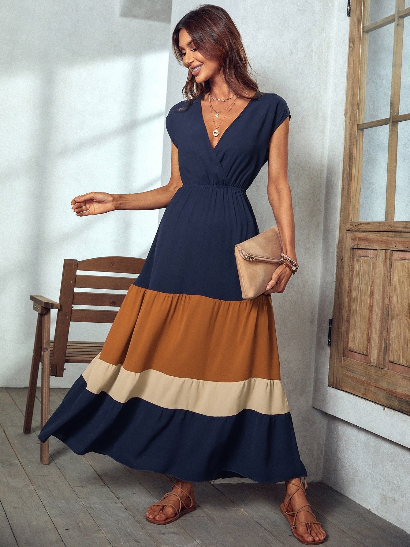 Unleash your inner beach babe with our Colorblock Elegance Maxi Dress. Featuring a surplice neck design and vibrant colorblock pattern, this dress is perfect for vacation and beach getaways. Embrace elegance and comfort while making a statement (without taking yourself too seriously).