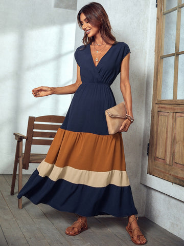 Unleash your inner beach babe with our Colorblock Elegance Maxi Dress. Featuring a surplice neck design and vibrant colorblock pattern, this dress is perfect for vacation and beach getaways. Embrace elegance and comfort while making a statement (without taking yourself too seriously).