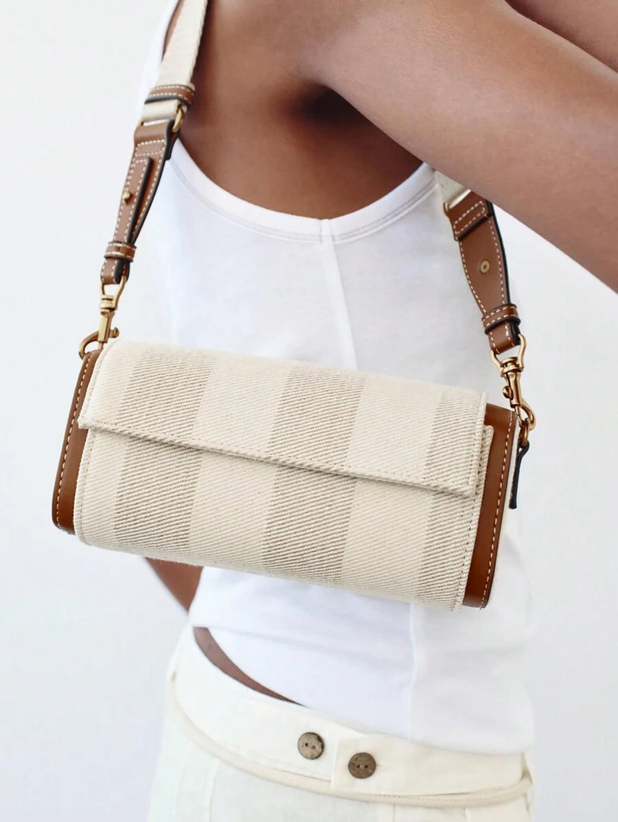 Refresh your everyday style with this colorblock flap crossbody bag for women. Featuring a modern colorblock design, elegant flap closure, and distinctive cylinder silhouette, this fashionable handbag blends contemporary style with everyday functionality for effortless wear from day to night.