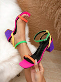 Color-block ankle-strap sandals with hot pink square toes orange toe straps green ankle straps yellow side straps and purple block heels
